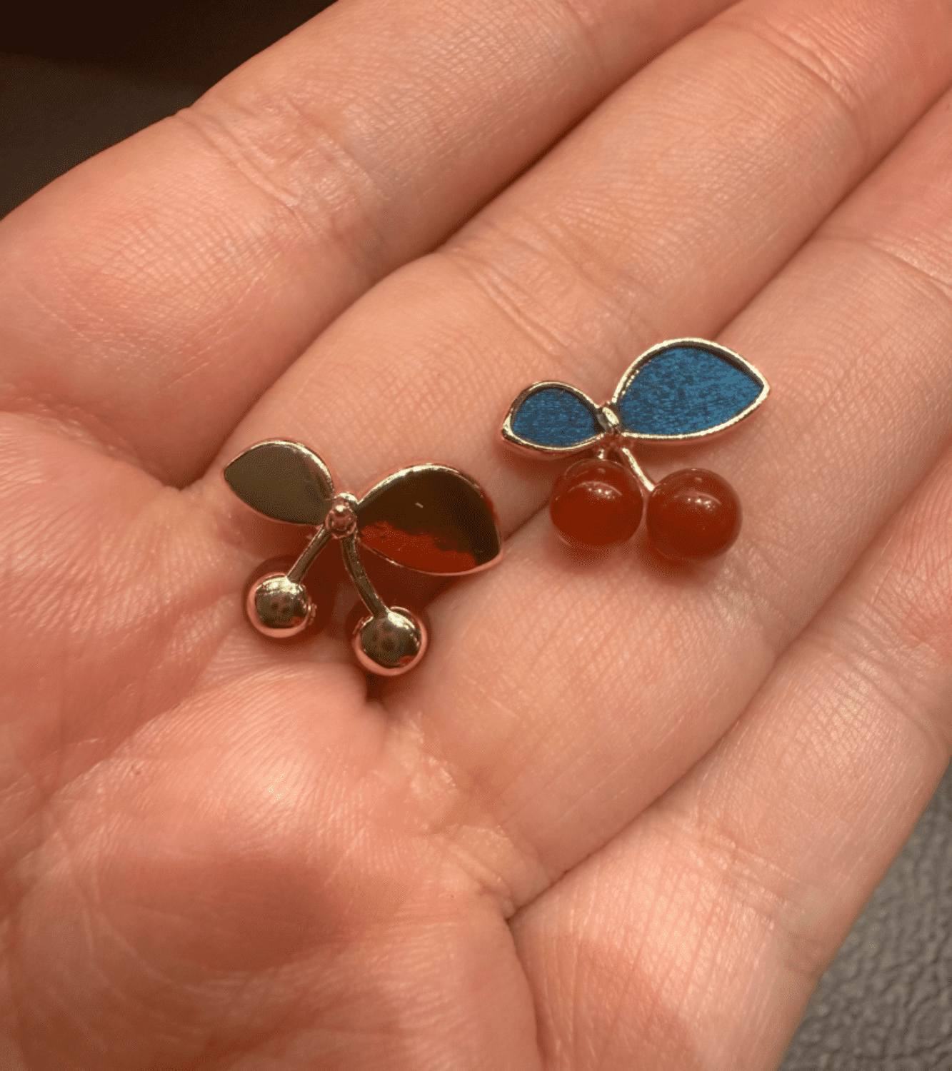 The back of Lena Cherry Glow Feather Stud Earrings – Handcrafted by Cici Dream