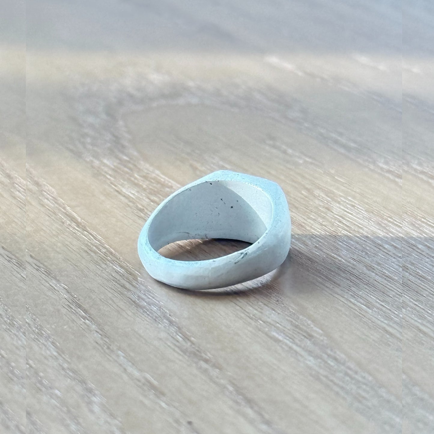 Back view of handmade 999 fine silver ring showing subtle handcraft marks and burnt white matte finish, by Cici Dream