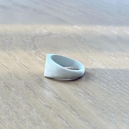 Detail of artisan silver ring’s burnt white finish and natural handcrafting marks on the 999 fine silver band, by Cici Dream